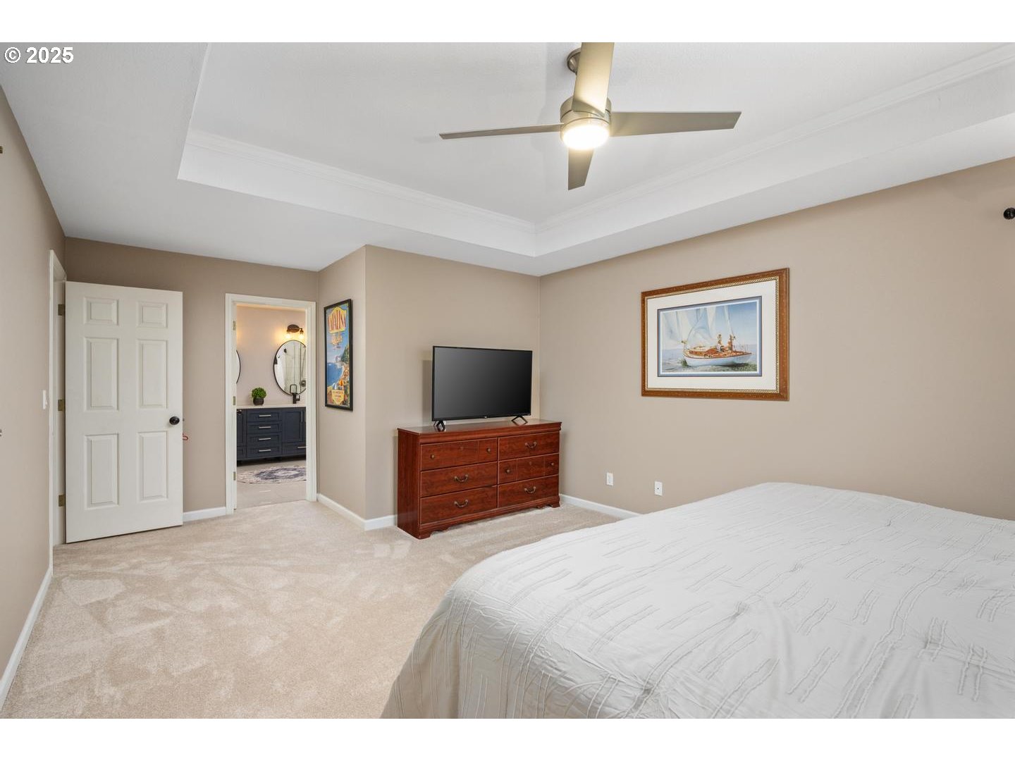 1626 Northwest Caitlin Terrace Portland, OR 97229 - Photo 19 of 48 a bedroom with a large bed and a chandelier