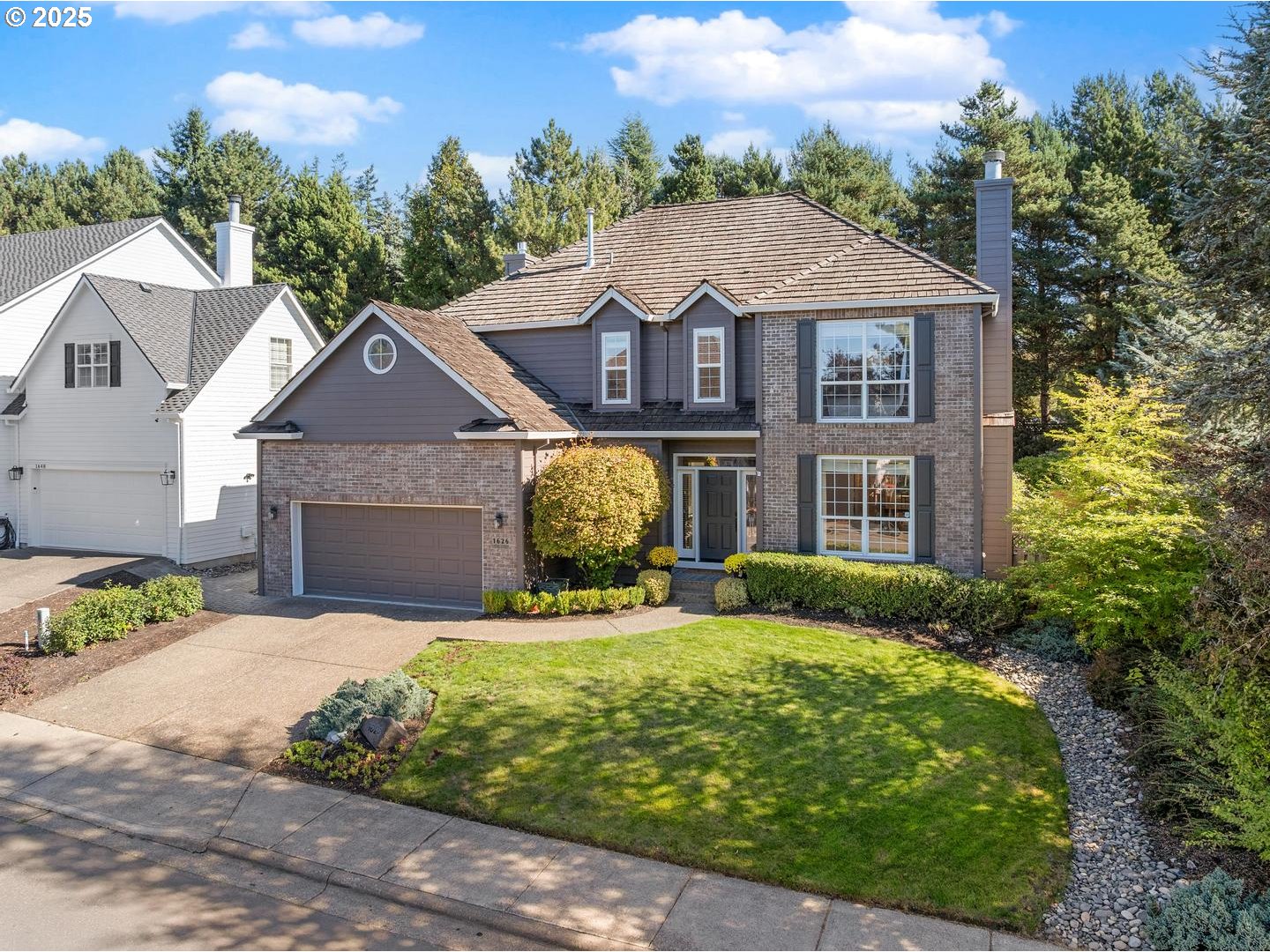 1626 Northwest Caitlin Terrace Portland, OR 97229 - Photo 2 of 48 a front view of a house with garden