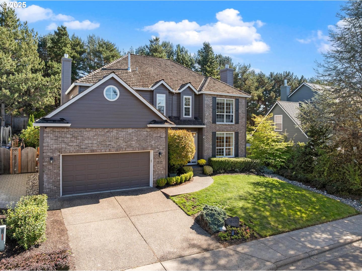 1626 Northwest Caitlin Terrace Portland, OR 97229 - Photo 3 of 48 a front view of a house with garden