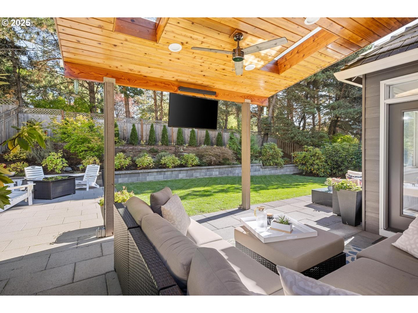 1626 Northwest Caitlin Terrace Portland, OR 97229 - Photo 36 of 48 a view of a patio with dining table and chairs with a small yard