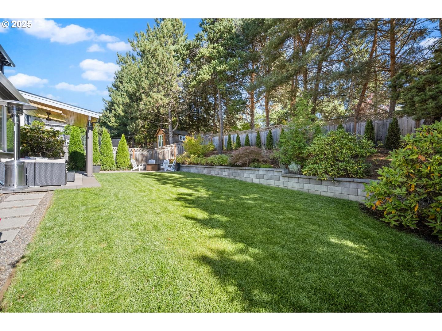 1626 Northwest Caitlin Terrace Portland, OR 97229 - Photo 40 of 48 a view of a backyard with a garden and trees