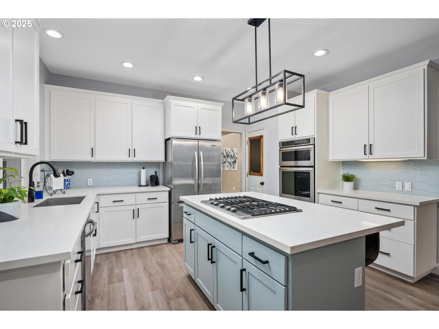 1626 Northwest Caitlin Terrace Portland, OR 97229 - Photo 5 of 48 a kitchen with a sink a stove a refrigerator and cabinets