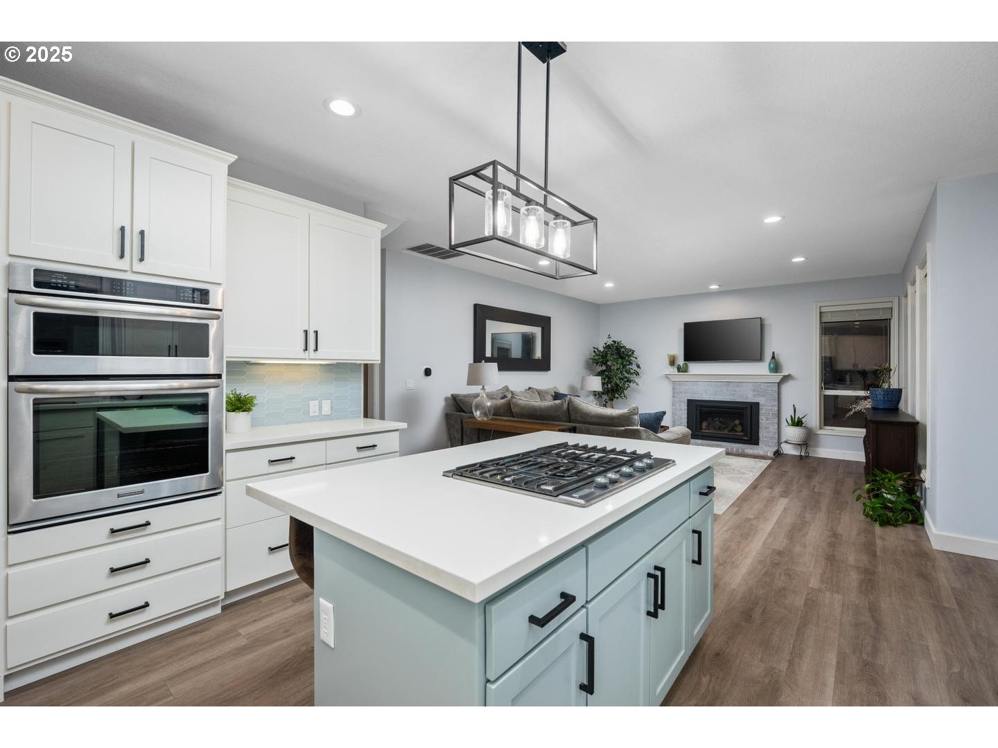 1626 Northwest Caitlin Terrace Portland, OR 97229 - Photo 8 of 48 a kitchen with a stove a microwave and wooden floor