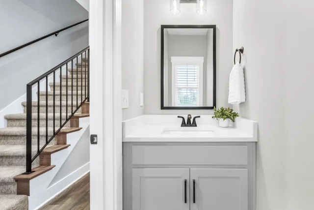 a bathroom with a sink and a mirror