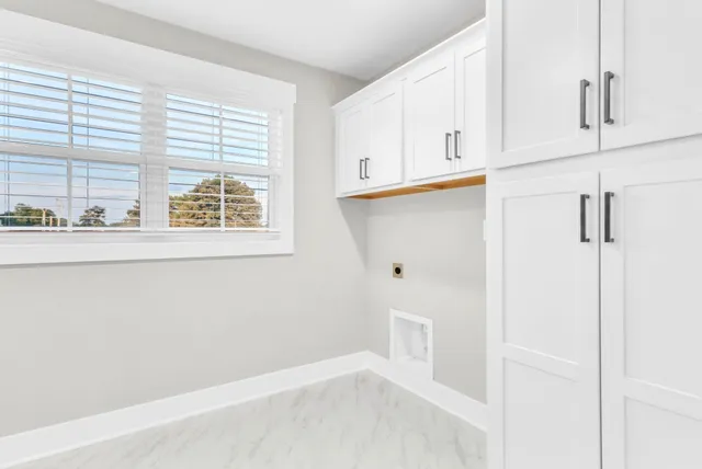 a view of kitchen with wooden floor and window