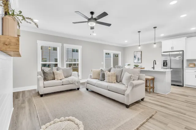 a living room with furniture white walls and white walls