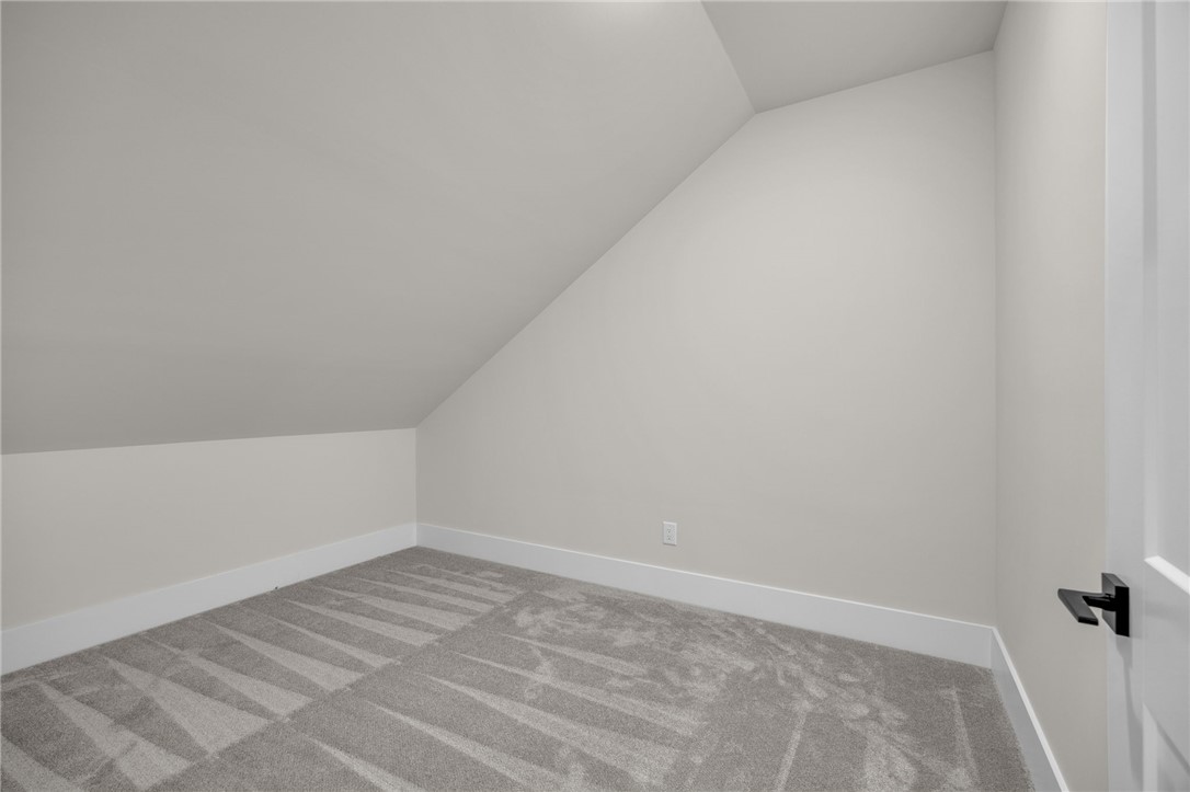 1230 Melton Road, Unit 216 West Union, SC 29696 - Photo 31 of 49 An inviting attic space with sloped ceilings offers versatile room for storage or customization.