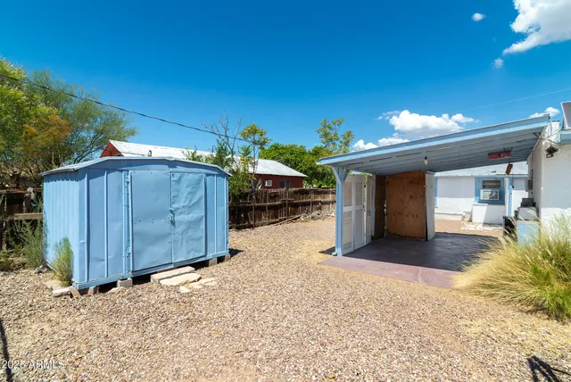 a view of a house with a snow in the yard