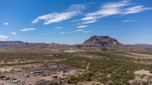 an aerial view of residential house and sandy dunes