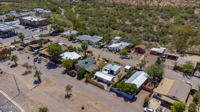 an aerial view of a house with a yard