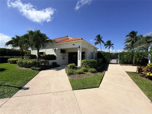 a view of house with outdoor space and garden