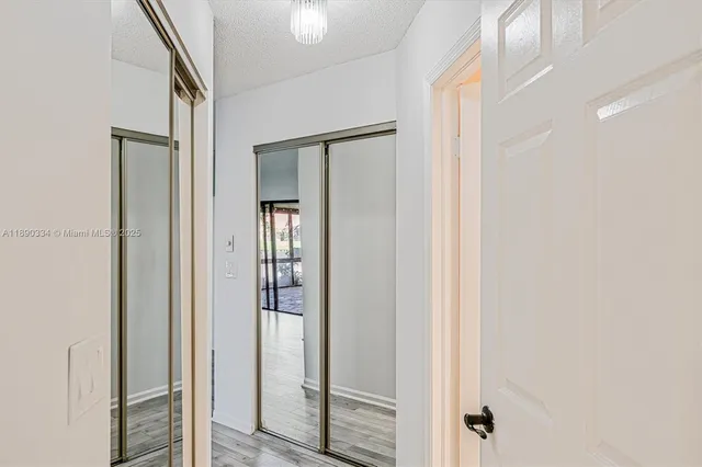 a view of a bathroom from a hallway