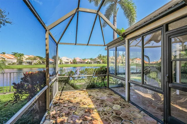 a view of a balcony with wooden floor