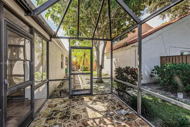 a view of a pathway of a house with an outdoor space