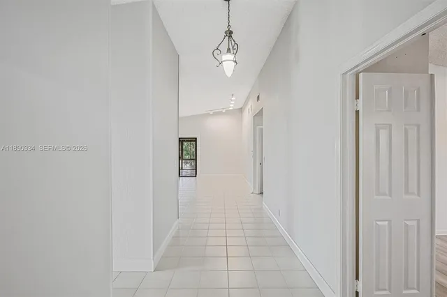 a view of a hallway with a white walls
