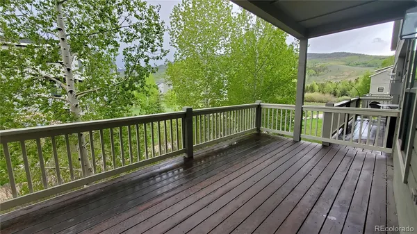 a view of balcony with wooden floor