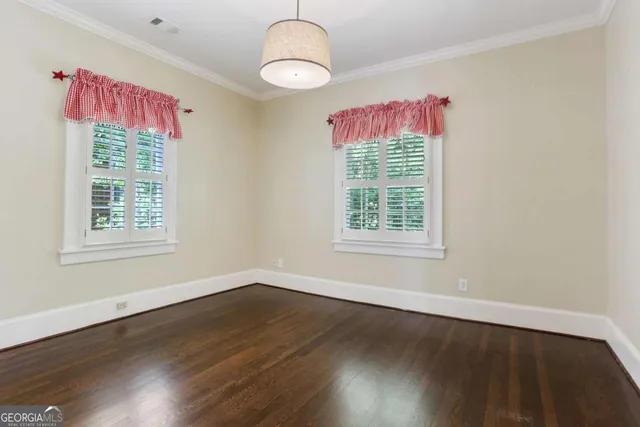 a bathroom with a sink a toilet a large mirror and shower
