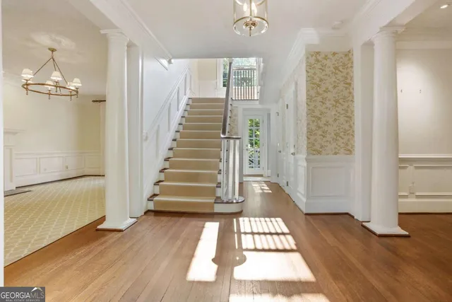 a view of entryway with wooden floor