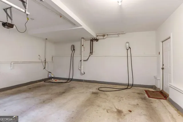 a kitchen with kitchen island a large counter top space stainless steel appliances and a window