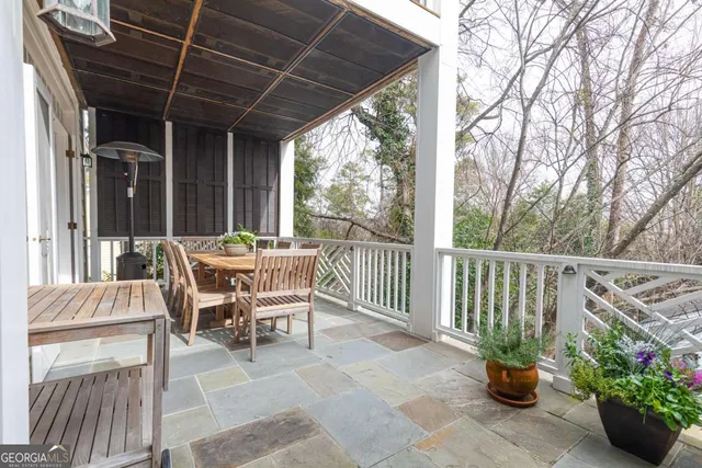 a view of a livingroom with wooden floor and a fireplace