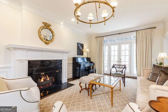 a living room with furniture fireplace and flat screen tv