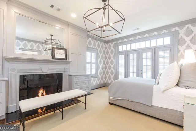 a bedroom with a large bed and a large window with outer view