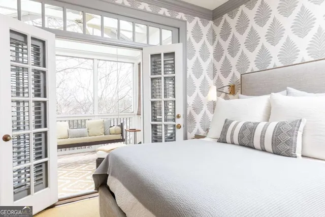 a bathroom with a double vanity sink a toilet and a window