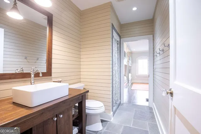 a bathroom with a tub and mirror