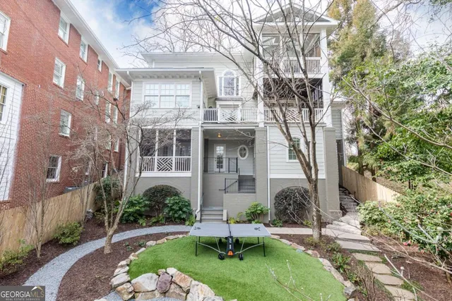 a bedroom with a bed window and table