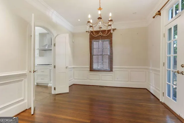 a kitchen with a stove a sink and a window