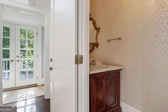 a view of an empty room with a fireplace and a window