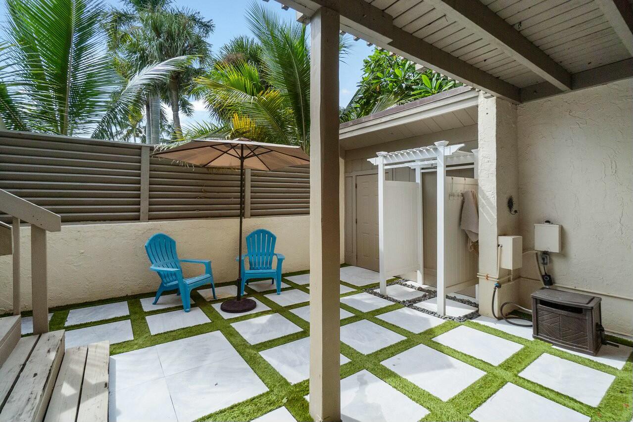1605 Highway 1, Unit 3H Jupiter, FL 33477 - Photo 13 of 20 a view of balcony with wooden floor and outdoor seating