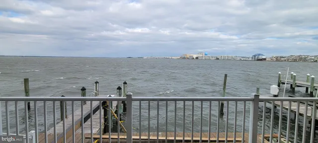 a view of a balcony next to a lake
