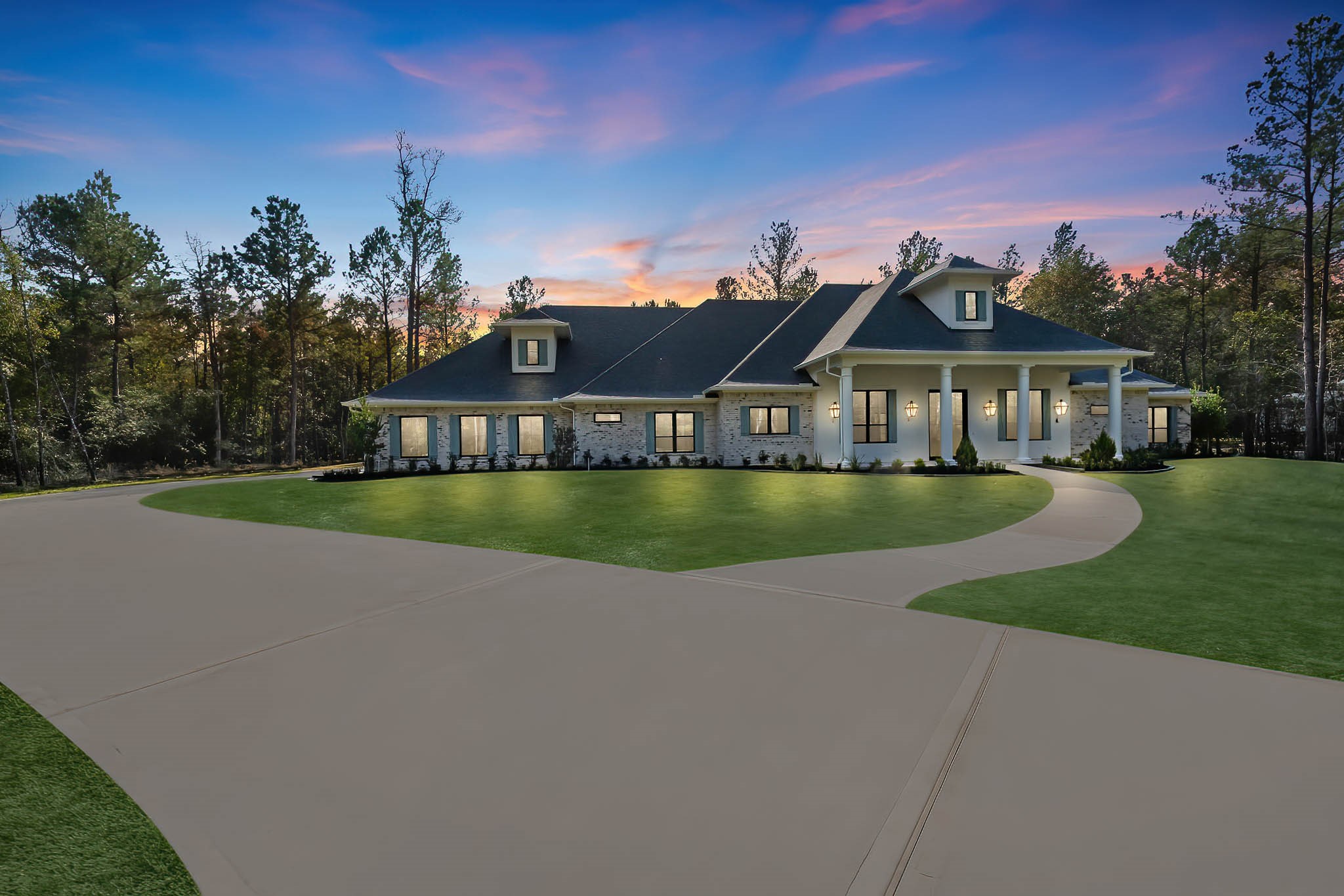 a view of a house with a garden and plants