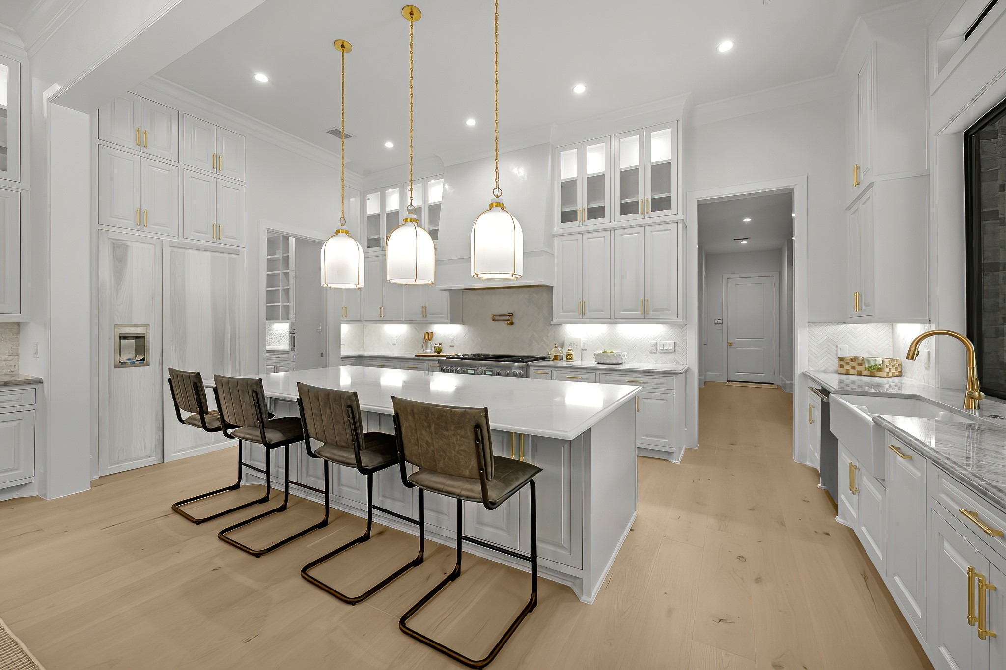 26041 Crown Ranch Boulevard Montgomery, TX 77316 - Photo 19 of 48 a kitchen with kitchen island a sink stove and refrigerator