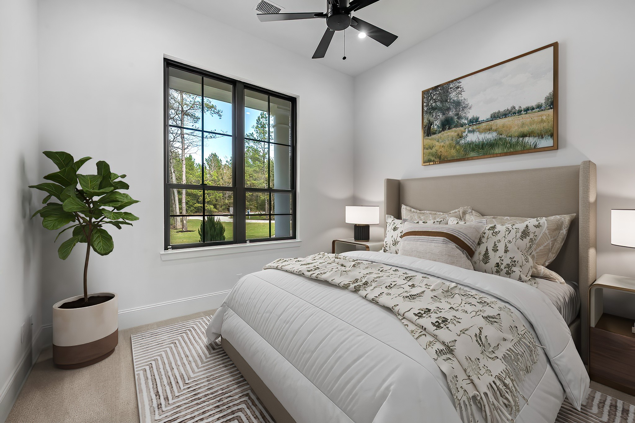 26041 Crown Ranch Boulevard Montgomery, TX 77316 - Photo 31 of 48 a bedroom with a large bed and a potted plant