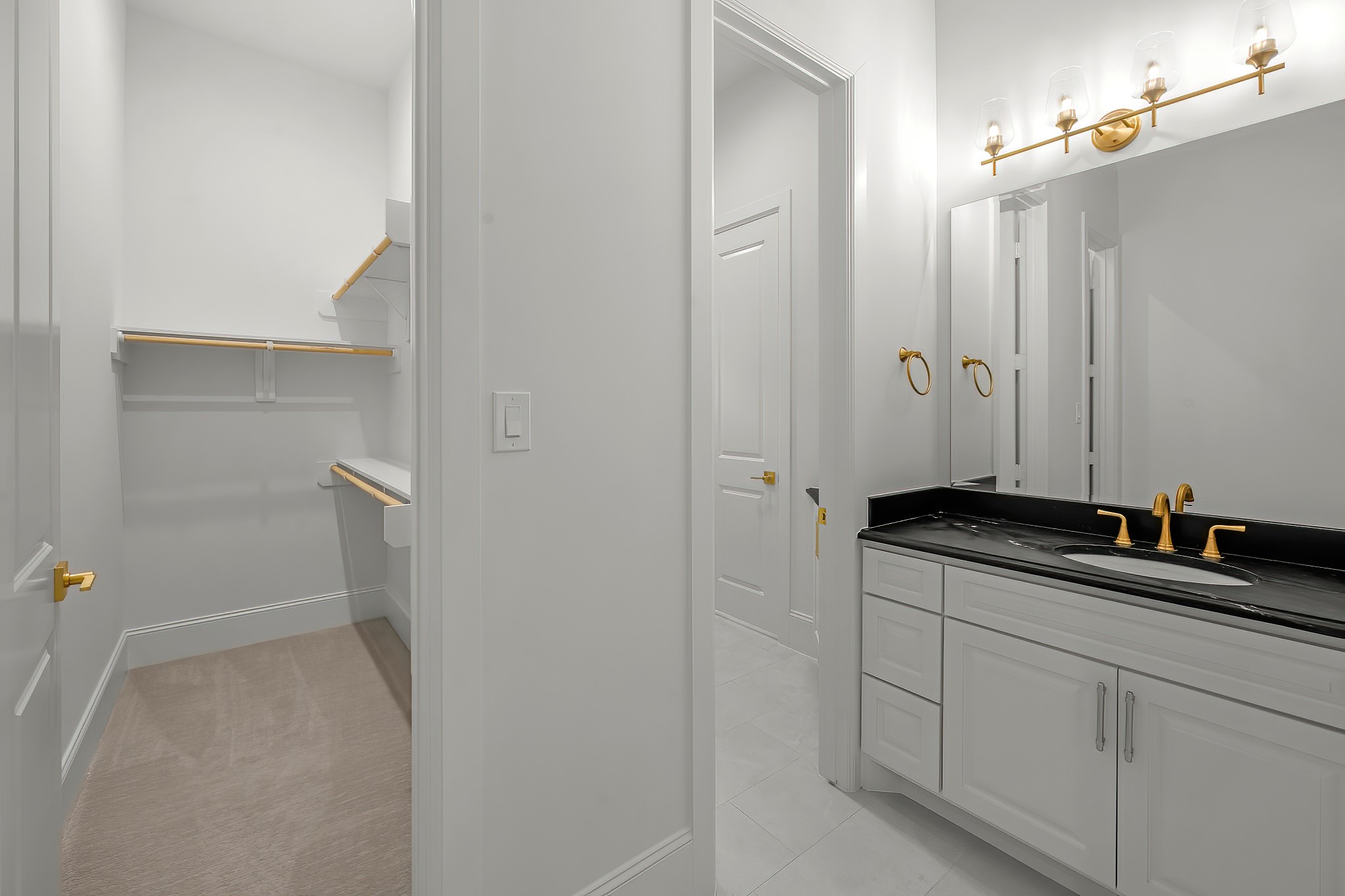 26041 Crown Ranch Boulevard Montgomery, TX 77316 - Photo 34 of 48 a bathroom with a granite countertop sink and a mirror