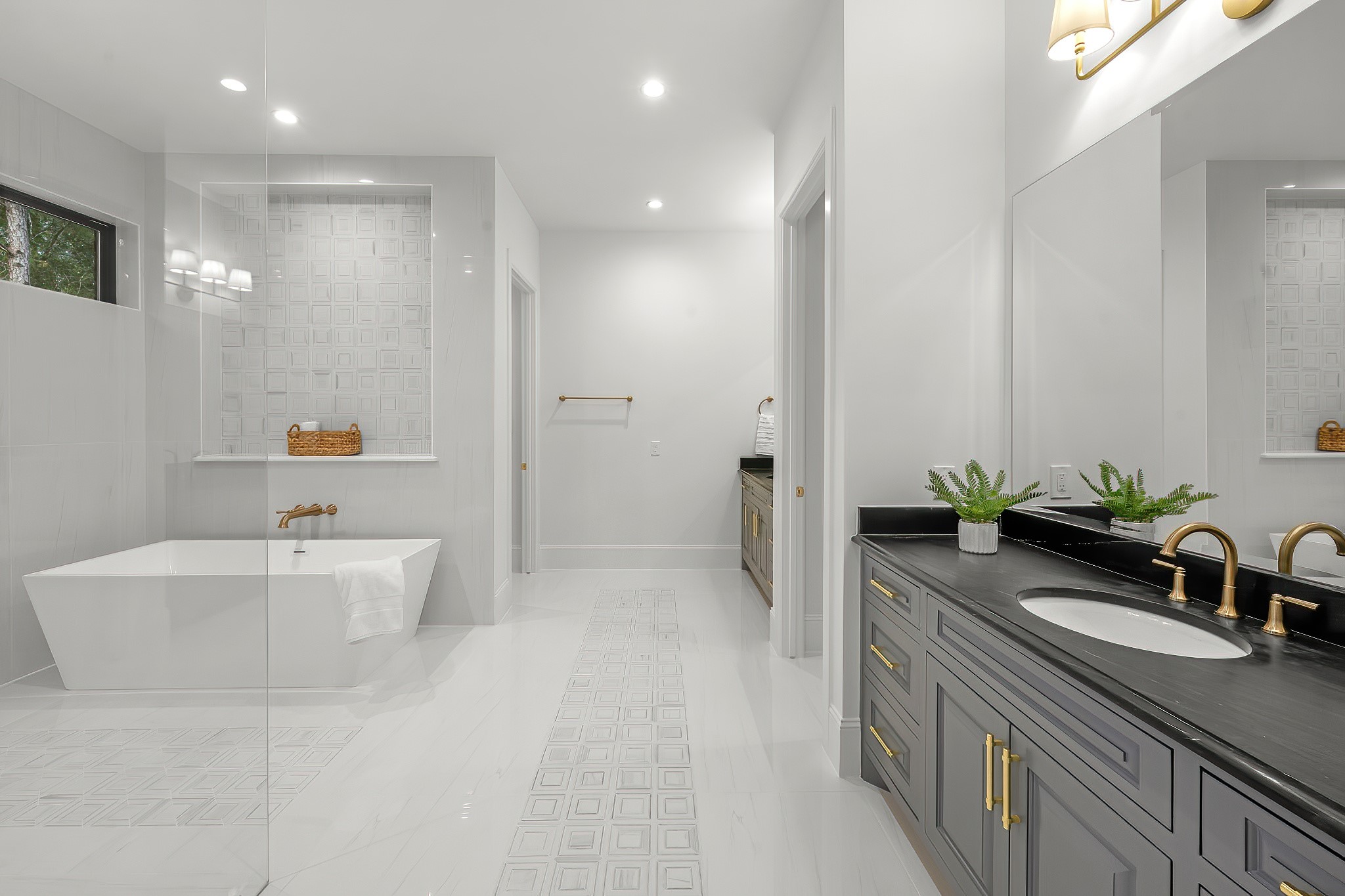 26041 Crown Ranch Boulevard Montgomery, TX 77316 - Photo 38 of 48 a bathroom with a tub sink and mirror