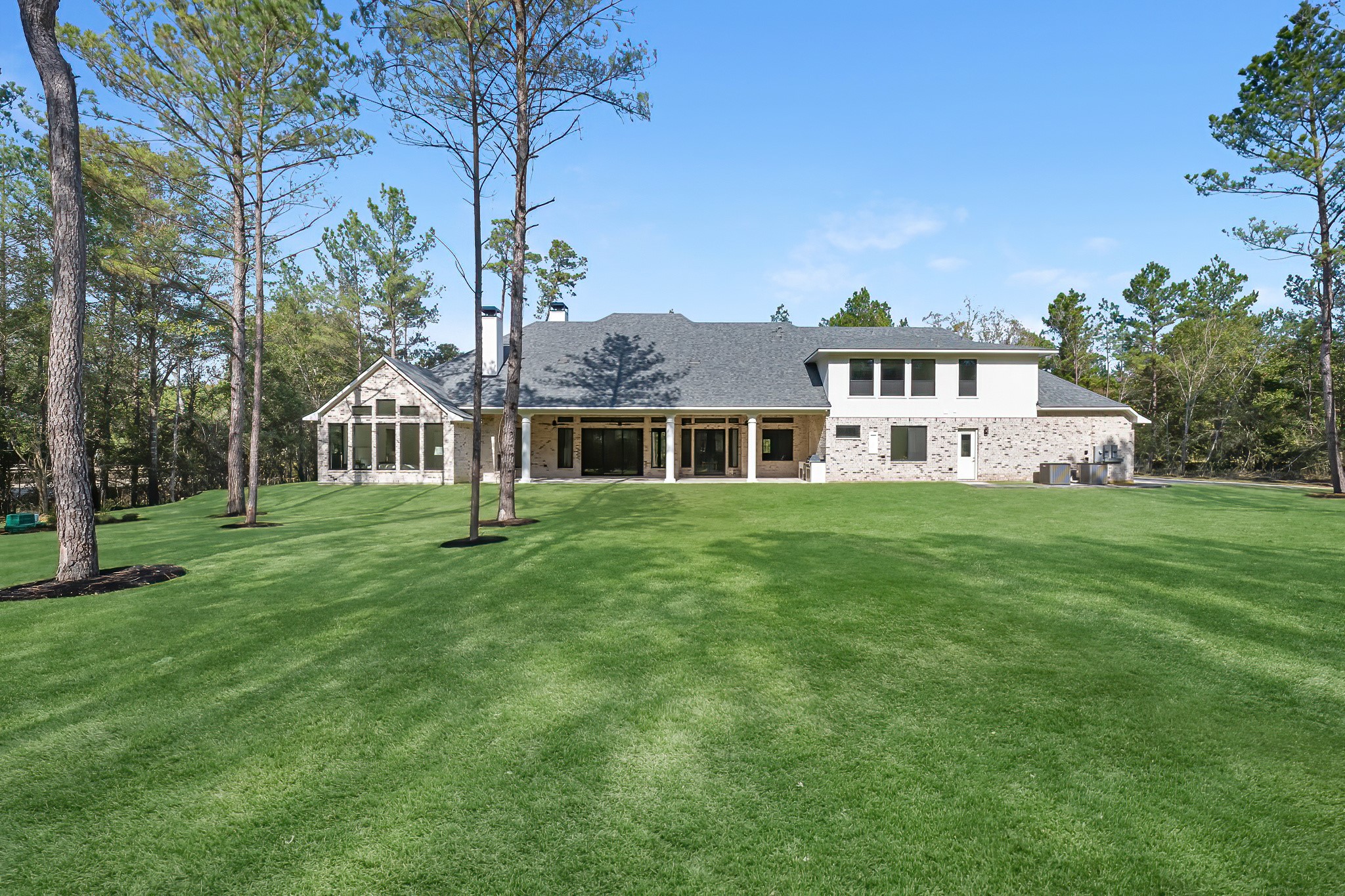 26041 Crown Ranch Boulevard Montgomery, TX 77316 - Photo 46 of 48 a front view of a house with a garden
