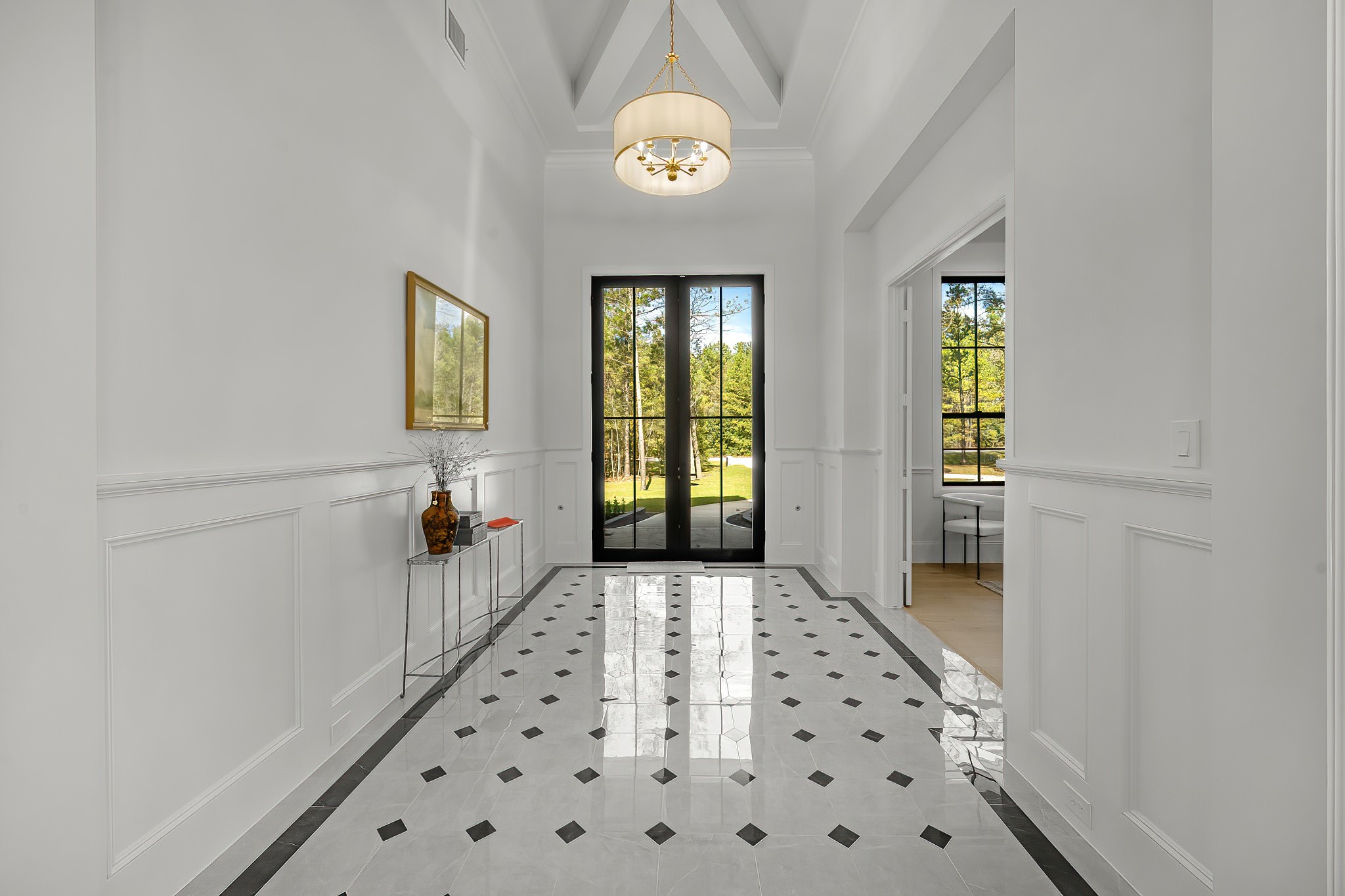 26041 Crown Ranch Boulevard Montgomery, TX 77316 - Photo 6 of 48 a hallway with windows and flowers