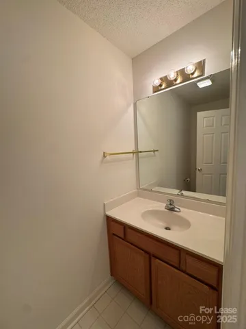 a bathroom with a sink and mirror