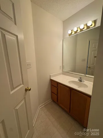 a bathroom with a double vanity sink and mirror