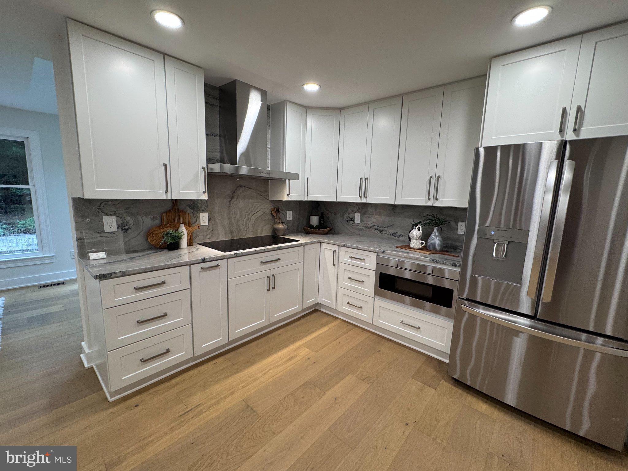 1132 Springvale Road Great Falls, VA 22066 - Photo 6 of 18 Modern kitchen with sleek finishes.