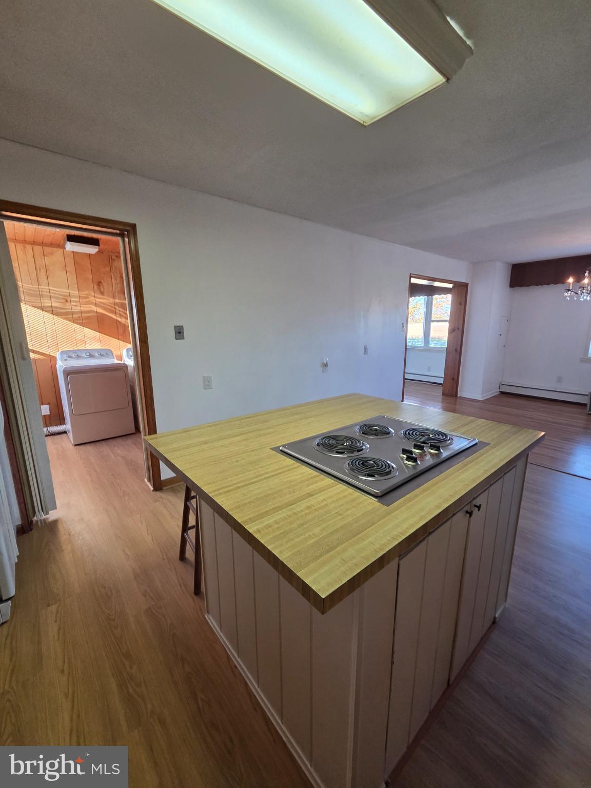 588 Gum Bush Road Townsend, DE 19734 - Photo 13 of 22 a kitchen that has a stove and a wooden floor