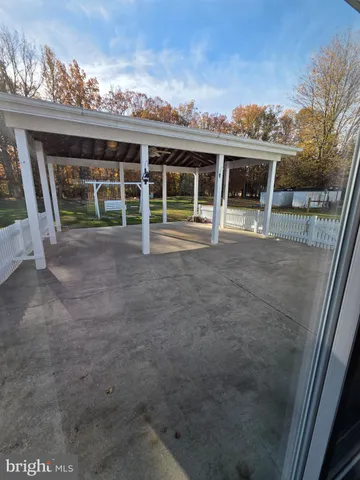 a view of a house with a porch and a table