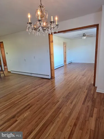 a view of a livingroom with wooden floor
