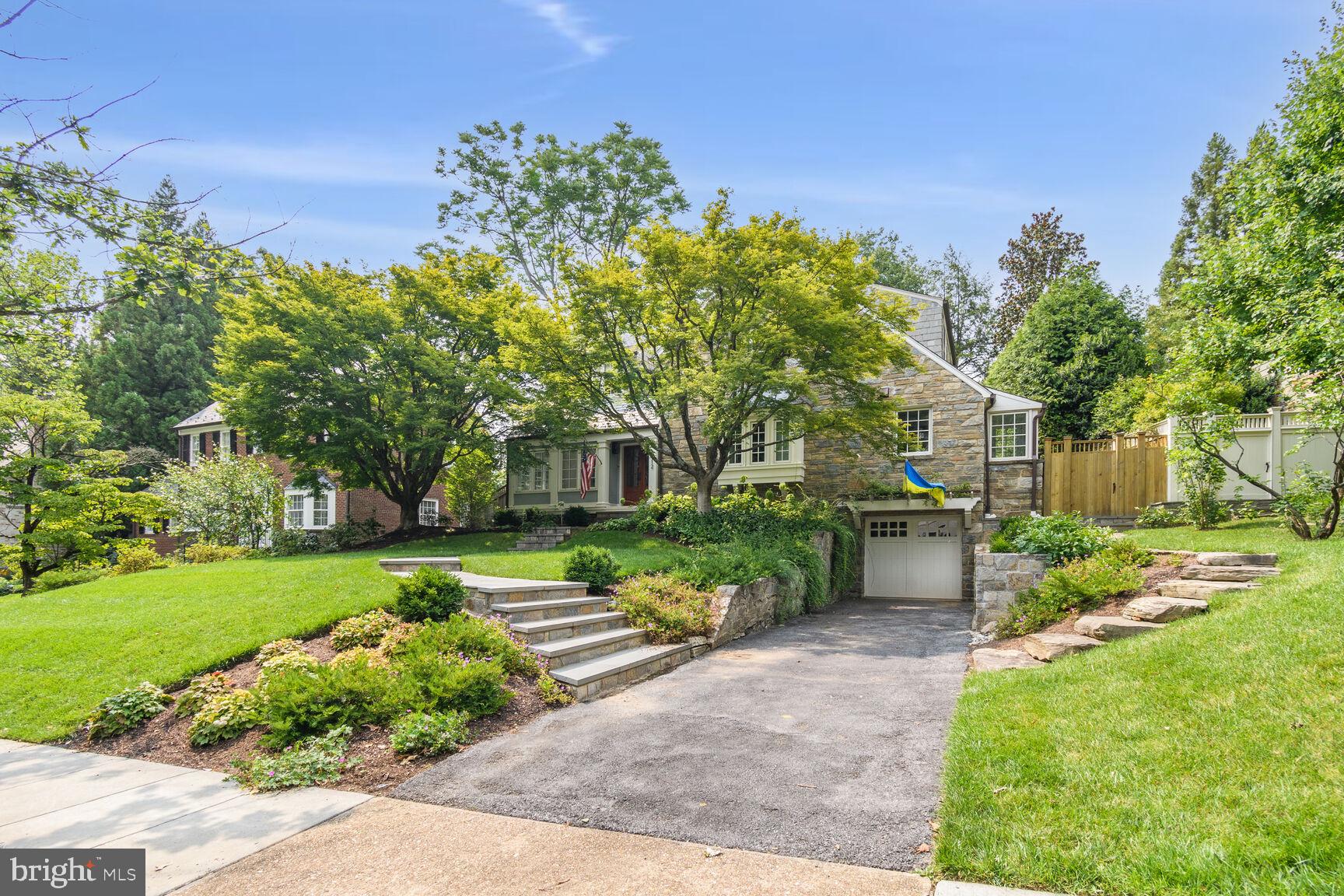 Charming home with lush greenery.