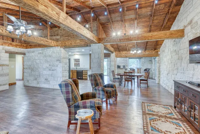 a view of a yard with plants and trees