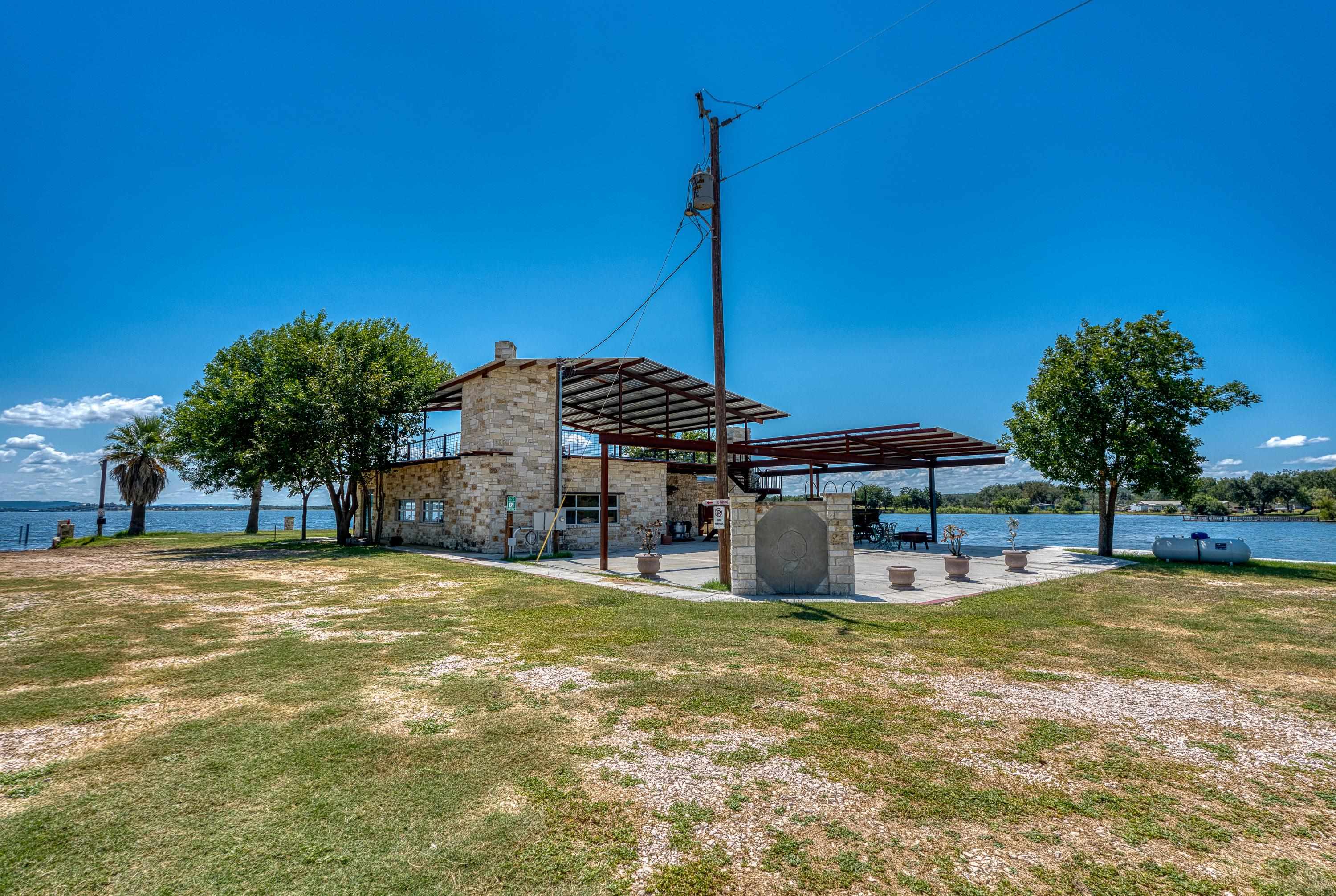 100 Scott Drive Tow, TX 78672 - Photo 2 of 28 a view of a house with swimming pool