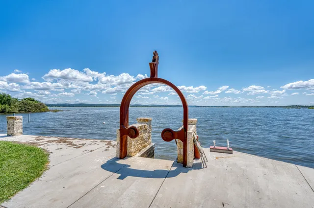 a view of a swimming pool with a yard